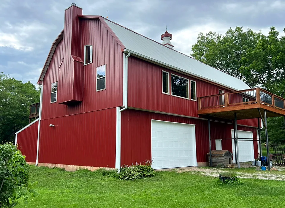 A red barn freshly painted by Red Barn Painting