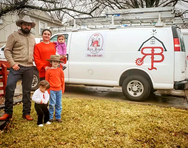 Abel and family with the Red Barn Painting van